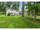 Charming exterior of home with lush landscaping, long driveway and inviting front porch at 2944 Braithwood Ne Ct, Atlanta, GA 30345