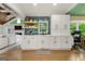 Functional kitchenette equipped with white cabinetry, and open shelving at 2944 Braithwood Ne Ct, Atlanta, GA 30345