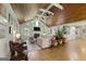 Open-concept living room with wood ceilings, fireplace, and seamless transition to the kitchen at 2944 Braithwood Ne Ct, Atlanta, GA 30345