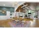 Open-concept living space with hardwood floors, fireplace, dining area and modern decor at 2944 Braithwood Ne Ct, Atlanta, GA 30345