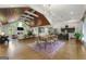 Open-concept living space with hardwood floors, fireplace, dining area and modern kitchen at 2944 Braithwood Ne Ct, Atlanta, GA 30345