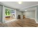 This living room has hardwood floors, neutral walls, and sliding glass doors to the back deck at 2944 Braithwood Ne Ct, Atlanta, GA 30345