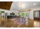 Open-concept living space with hardwood floors, dining area, modern kitchen and view to outside at 2944 Braithwood Ne Ct, Atlanta, GA 30345