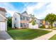 Charming home with a well-manicured lawn, brick accents, and inviting curb appeal at 8750 Redford Ln, Suwanee, GA 30024