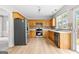 Well-lit kitchen with stainless steel appliances, light wood cabinets, and ample counter space for cooking and meal preparation at 8750 Redford Ln, Suwanee, GA 30024