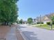 A wide shot of the street, with well-maintained lawns and diverse home exteriors at 8750 Redford Ln, Suwanee, GA 30024
