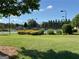 Community tennis courts, with well-maintained grounds and ample green space at 8750 Redford Ln, Suwanee, GA 30024