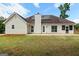 Expansive backyard featuring a patio and solar panels on a home in a serene, natural setting at 501 Llewellyn Ct, Jenkinsburg, GA 30234