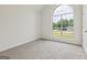 Bright bedroom with neutral carpet, large window and a closet at 501 Llewellyn Ct, Jenkinsburg, GA 30234