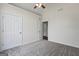 A bright bedroom with neutral carpet and two closets at 501 Llewellyn Ct, Jenkinsburg, GA 30234