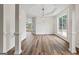 Dining room boasts natural light, elegant trim, and wood floors, offering a comfortable space for meals at 501 Llewellyn Ct, Jenkinsburg, GA 30234