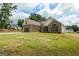 Lovely brick home with large front lawn and attached garage, blending comfort and curb appeal at 501 Llewellyn Ct, Jenkinsburg, GA 30234