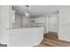 Bright kitchen featuring granite countertops, wooden floors and modern lighting at 501 Llewellyn Ct, Jenkinsburg, GA 30234