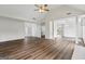 Inviting living room with wood floors, vaulted ceiling, and an open layout, ideal for entertaining guests at 501 Llewellyn Ct, Jenkinsburg, GA 30234