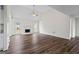 Open-concept living room featuring a fireplace, wood floors, and a vaulted ceiling, offering a welcoming atmosphere at 501 Llewellyn Ct, Jenkinsburg, GA 30234