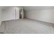 This room offers neutral carpet and multiple entry points at 501 Llewellyn Ct, Jenkinsburg, GA 30234