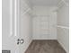 Walk-in closet with carpeted floors and wire shelving at 501 Llewellyn Ct, Jenkinsburg, GA 30234