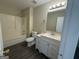 Bathroom featuring a vanity with storage, toilet, and bathtub with shower head at 756 Glenshire Ct, Riverdale, GA 30274