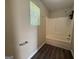 Bright bathroom with a window and a shower-tub combo at 756 Glenshire Ct, Riverdale, GA 30274