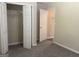 Bedroom with closet and doorway, featuring neutral walls and carpet at 756 Glenshire Ct, Riverdale, GA 30274
