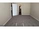 Spacious bedroom with neutral walls and carpet, featuring an open doorway at 756 Glenshire Ct, Riverdale, GA 30274
