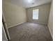 Carpeted bedroom with one window and neutral walls at 756 Glenshire Ct, Riverdale, GA 30274