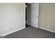 Bedroom with neutral walls, carpet, and an open doorway at 756 Glenshire Ct, Riverdale, GA 30274