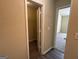 Hallway with a view of a bedroom and a closet with an open door at 756 Glenshire Ct, Riverdale, GA 30274