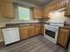 Bright kitchen featuring laminate countertops and white appliances at 756 Glenshire Ct, Riverdale, GA 30274