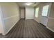 Spacious living area with laminate floors, closet, and a back door at 756 Glenshire Ct, Riverdale, GA 30274