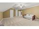 Large bedroom with carpeted floor, a bed and doorways with neutral colored walls at 150 Campaign Trl, Fayetteville, GA 30214
