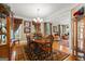 Traditional dining room featuring hardwood floors and an elegant chandelier at 150 Campaign Trl, Fayetteville, GA 30214