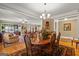 Formal dining area with a wooden table, chairs, and an ornate rug at 150 Campaign Trl, Fayetteville, GA 30214