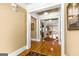 Welcoming foyer with hardwood floors, tasteful decor, and elegant white trim, creating a grand entrance at 150 Campaign Trl, Fayetteville, GA 30214