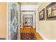Inviting foyer with hardwood floors, elegant trim, and a beautiful decorative glass front door at 150 Campaign Trl, Fayetteville, GA 30214