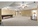 Open game room with neutral walls, carpeted floor, a pool table, and multiple doorways at 150 Campaign Trl, Fayetteville, GA 30214