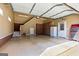 Spacious garage with ample storage cabinets, painted floors, access to a staircase, and overhead lighting at 150 Campaign Trl, Fayetteville, GA 30214