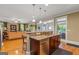 Kitchen area featuring a breakfast bar with sink and view to the living area at 150 Campaign Trl, Fayetteville, GA 30214