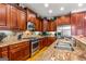 Well-equipped kitchen featuring granite countertops and stainless steel appliances at 150 Campaign Trl, Fayetteville, GA 30214