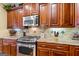 Close-up of a kitchen with stainless steel stove and granite countertops at 150 Campaign Trl, Fayetteville, GA 30214