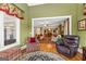 Comfortable sitting area with hardwood floors and a view of the dining room at 150 Campaign Trl, Fayetteville, GA 30214