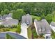 Aerial view of the home showcasing its well-maintained landscaping and neighborhood at 825 Chalet Hls, Mcdonough, GA 30253