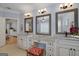 Bright bathroom with double vanity and white cabinets at 825 Chalet Hls, Mcdonough, GA 30253