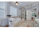 Modern bathroom featuring a bathtub, separate glass shower, and tile flooring at 825 Chalet Hls, Mcdonough, GA 30253
