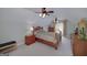 The upstairs bedroom features wood furniture, neutral walls, and natural light with an attic ceiling at 825 Chalet Hls, Mcdonough, GA 30253