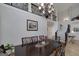 Elegant dining room with chandelier and staircase at 825 Chalet Hls, Mcdonough, GA 30253