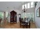 Formal dining area with hardwood floors, chandelier, and large windows for plenty of light at 825 Chalet Hls, Mcdonough, GA 30253