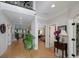 Bright hallway with hardwood floors, white trim, and views into other rooms of the house at 825 Chalet Hls, Mcdonough, GA 30253