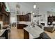 Open kitchen features granite countertops, stainless steel appliances, and ample counter space at 825 Chalet Hls, Mcdonough, GA 30253