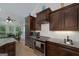 Gourmet kitchen featuring granite countertops, stainless steel appliances, and white tiled backsplash at 825 Chalet Hls, Mcdonough, GA 30253